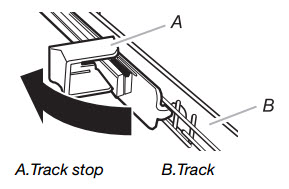 Flip the track stop to the outside of the track to remove.