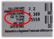 The type of refrigerant stored in the refrigerator can be found on the model and serial number tab.